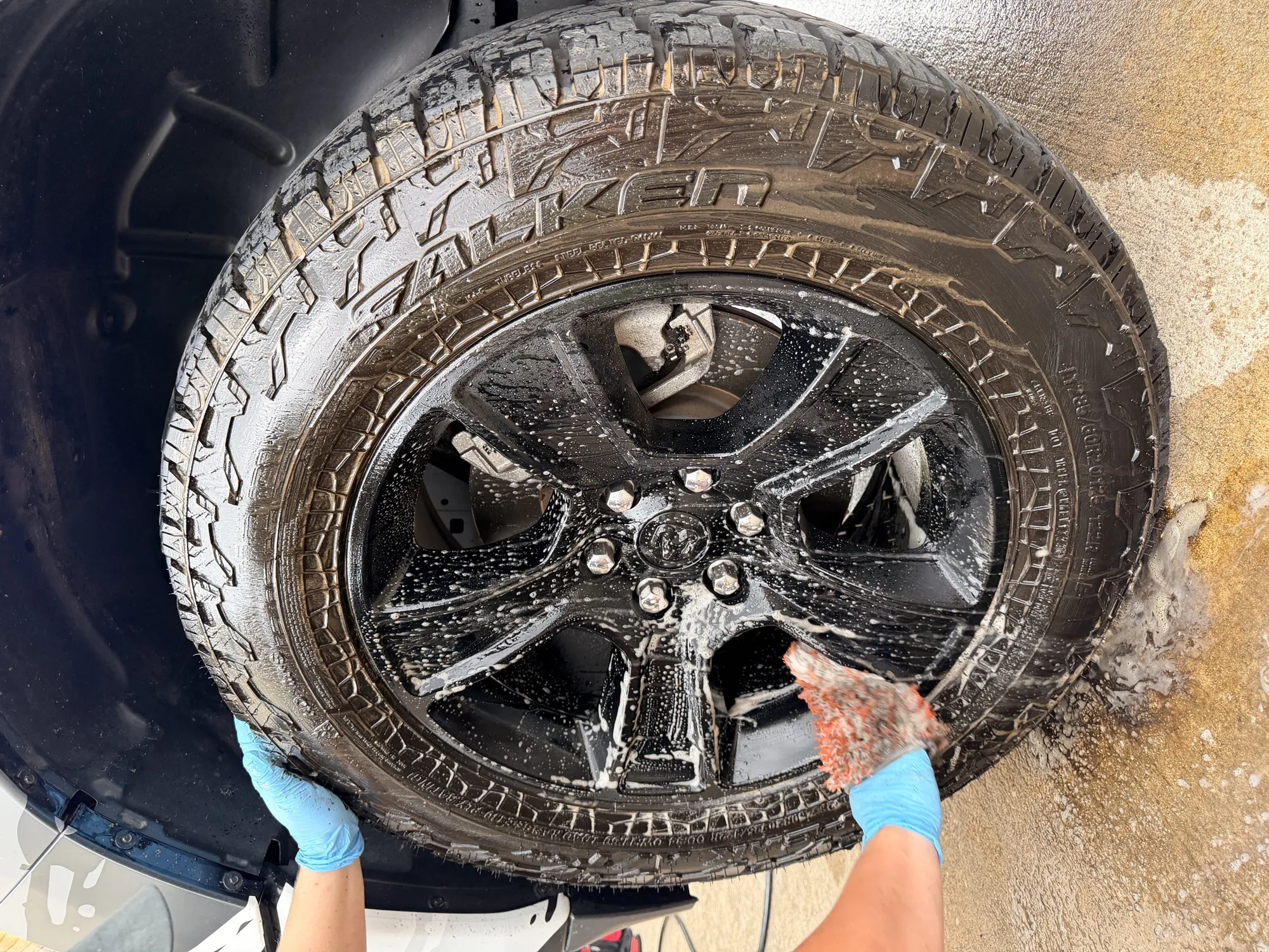 Hand cleaning a wheel and tire